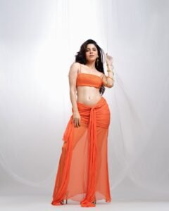 Divya Bharathi Dazzles in Orange Western Crop Top and Skirt Photos (9)