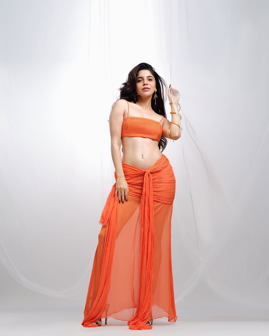Divya Bharathi Dazzles in Orange Western Crop Top and Skirt Photos (9)
