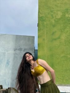 Divya Bharathi Stuns in Olive Green Saree and Yellow Blouse Photos (14)