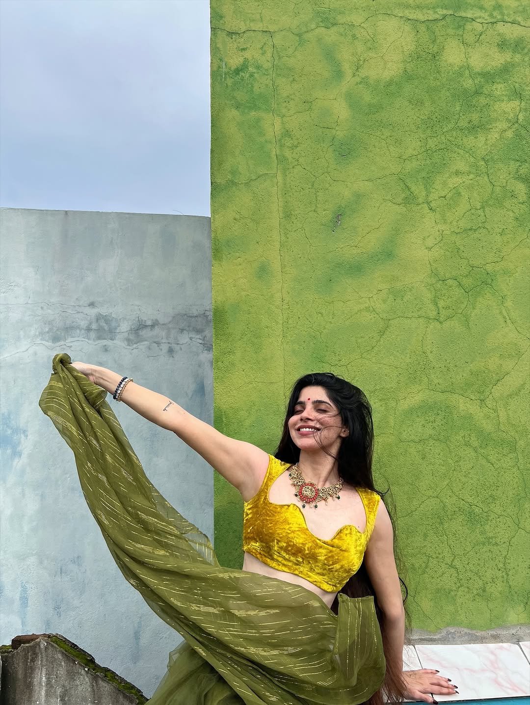 Divya Bharathi Stuns in Olive Green Saree and Yellow Blouse Photos (18)
