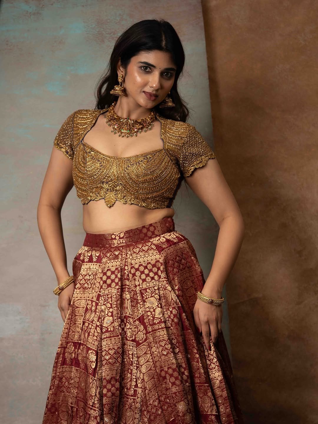 Pragya Nagra Stuns in Maroon Gold Lehenga Photos (1)