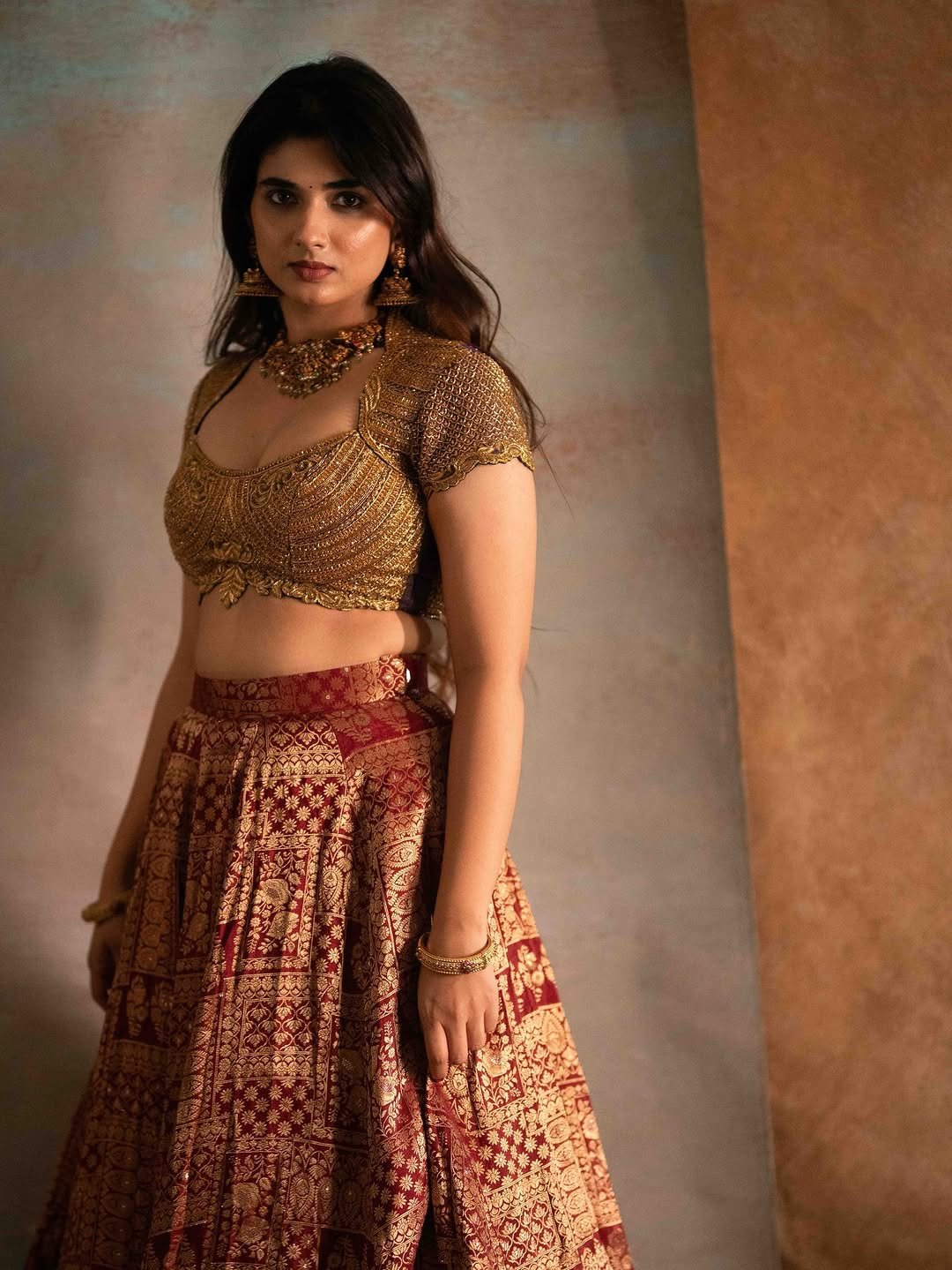Pragya Nagra Stuns in Maroon Gold Lehenga Photos (10)