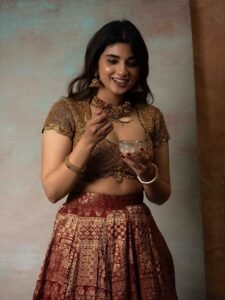 Pragya Nagra Stuns in Maroon Gold Lehenga Photos (14)