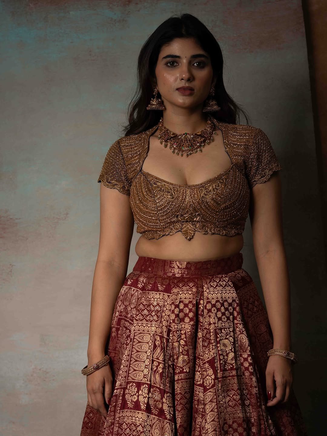 Pragya Nagra Stuns in Maroon Gold Lehenga Photos (15)