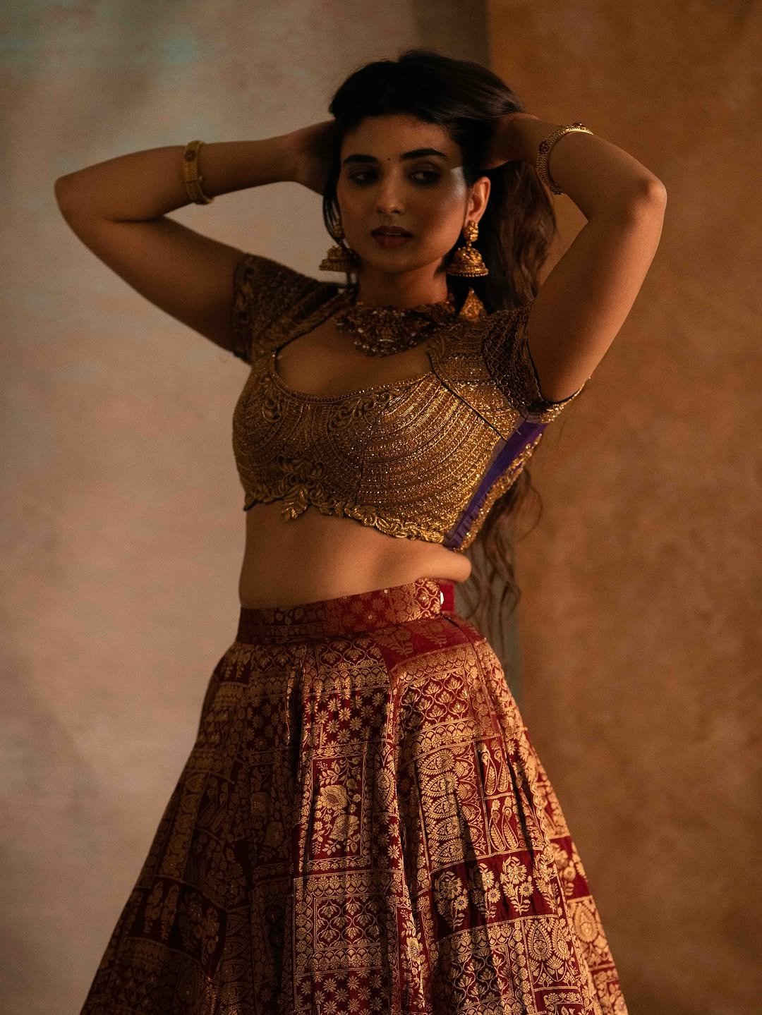 Pragya Nagra Stuns in Maroon Gold Lehenga Photos (16)