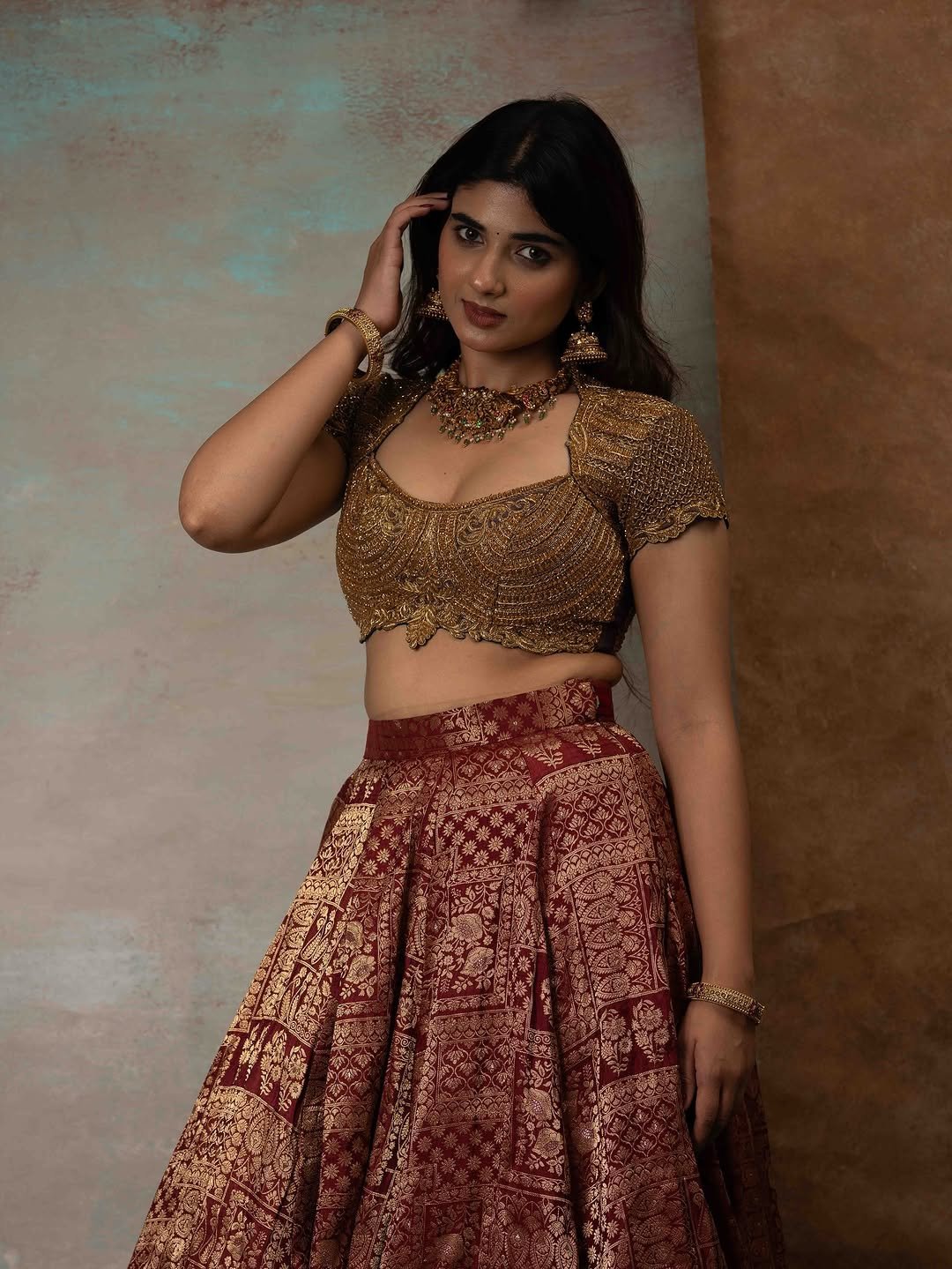 Pragya Nagra Stuns in Maroon Gold Lehenga Photos (5)