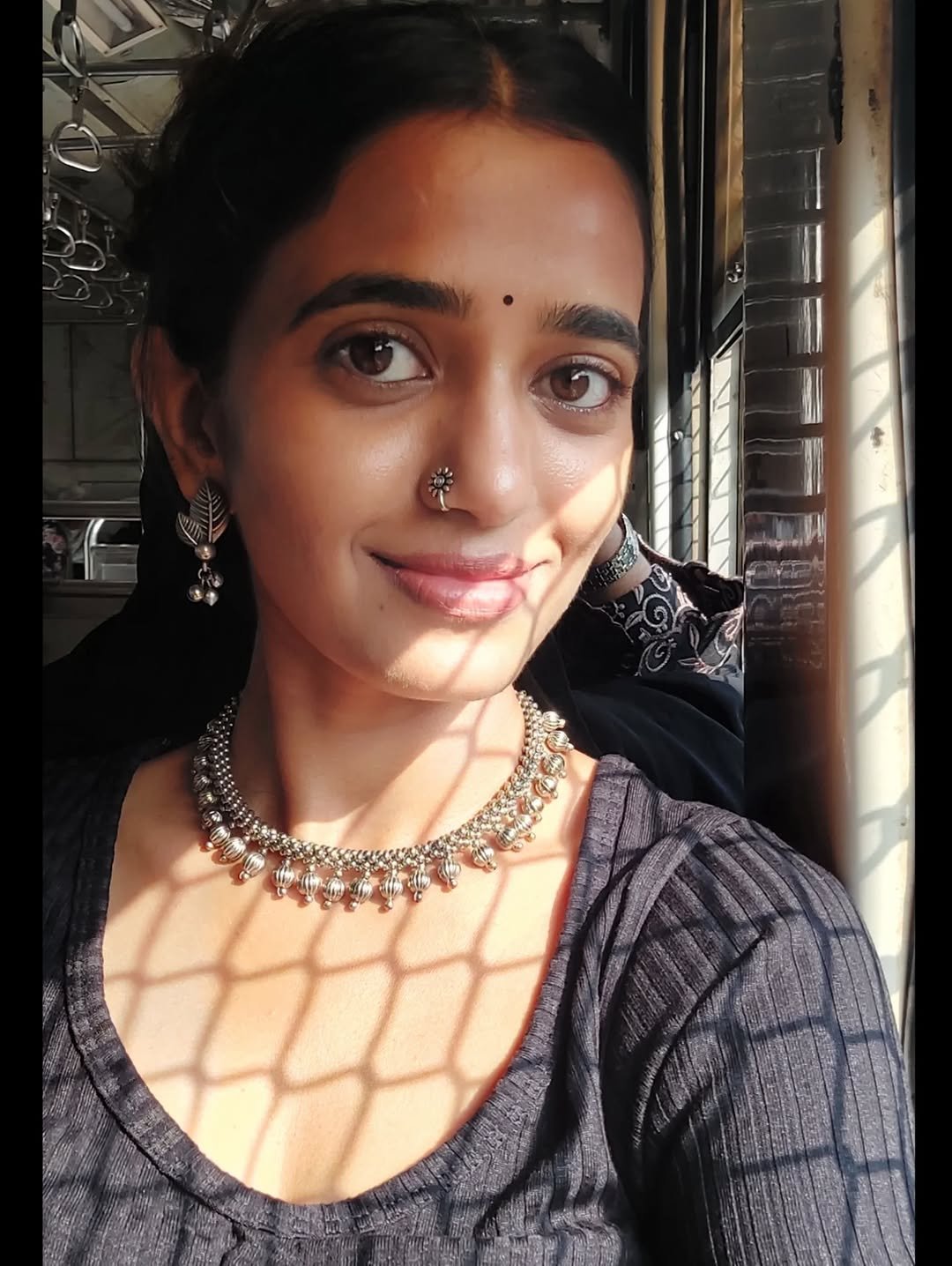 Trupti Ravindra Sunlit Train Selfie with Silver Choker (1)