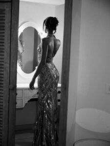 Ananya posing with arms outstretched surrounded by mirror reflections