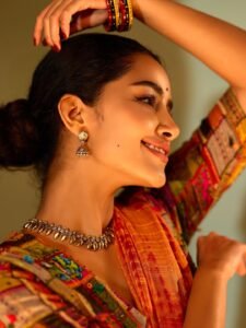 Anupama sitting on verandah in traditional South Indian attire