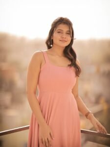 Arul Jyothi in blush pink chiffon co-ord set in blooming garden