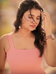 Arul twirling in pink outfit with dupatta flowing in breeze