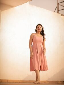 Arul twirling in pink outfit with dupatta flowing in breeze