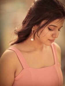 Arul Jyothi in blush pink chiffon co-ord set in blooming garden