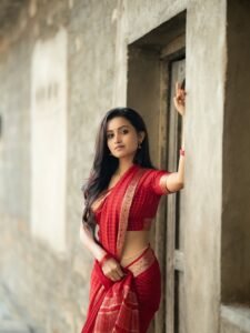 Deepika posing in decorated mandap with marigold garlands