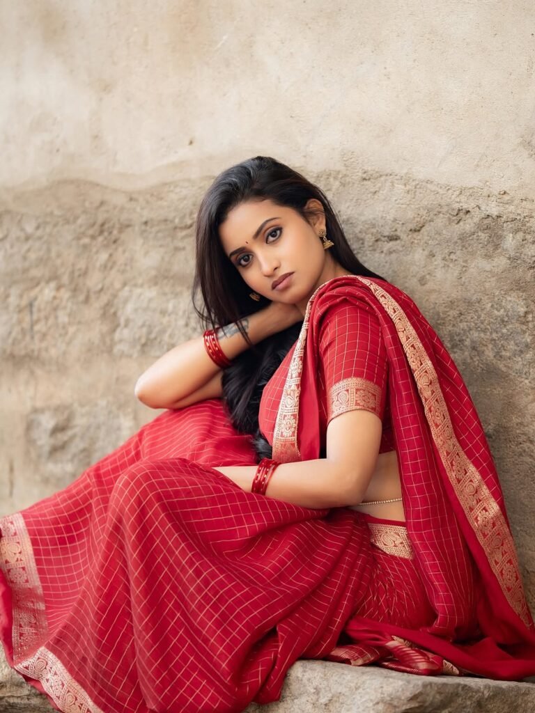 Deepika posing in decorated mandap with marigold garlands