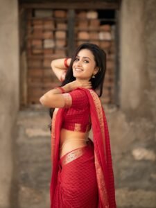 Deepika posing in decorated mandap with marigold garlands