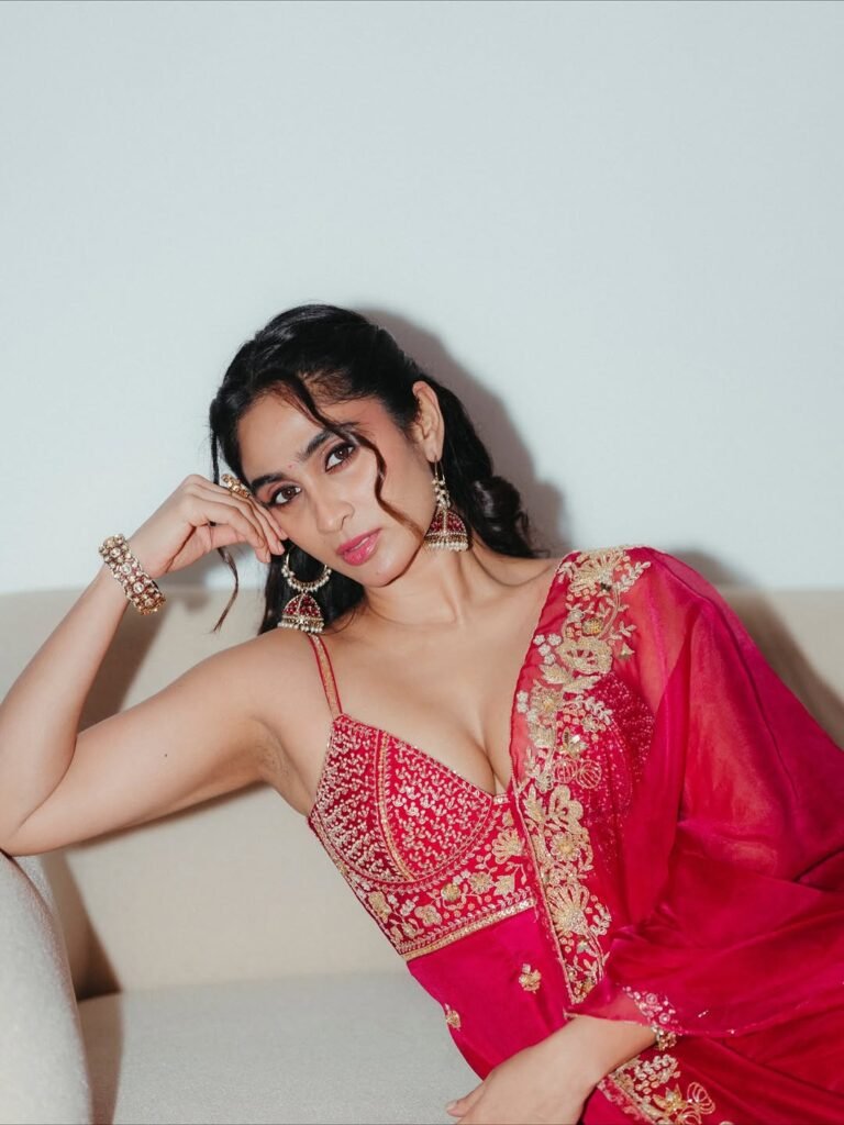 Deepti Sati in crimson Banarasi saree with gold zari during bridal shoot