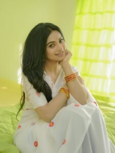 Delna Davis in white Kasavu saree with gold border during traditional shoot