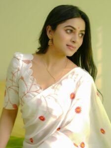 Delna Davis in white Kasavu saree with gold border during traditional shoot