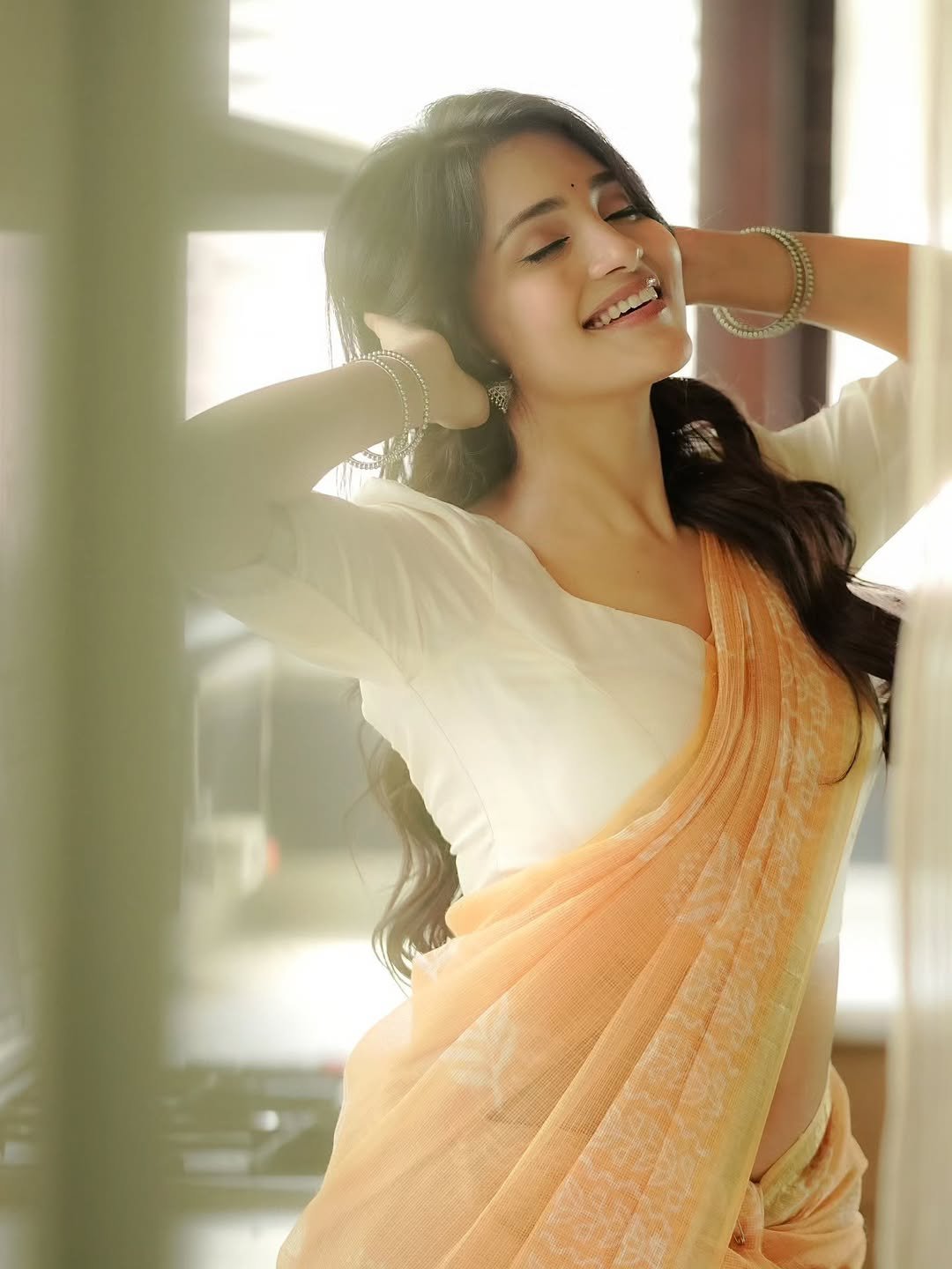 Dharshna Sripal Golecha Looks Elegant in a Peach Saree With White Blouse (2)