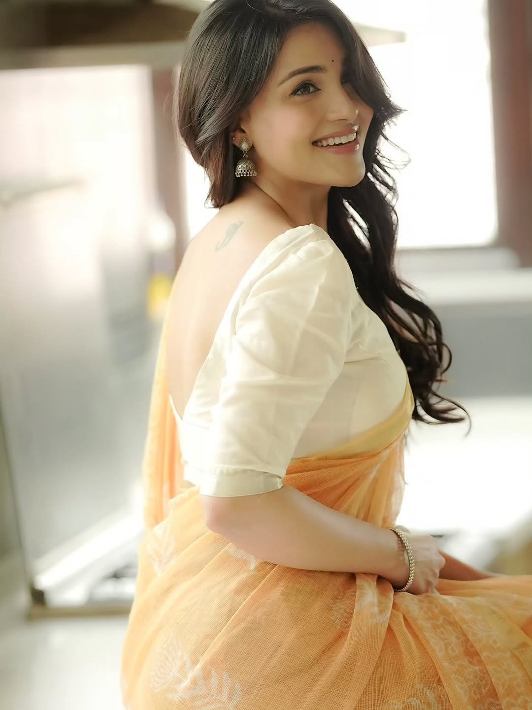 Dharshna Sripal Golecha Looks Elegant in a Peach Saree With White Blouse (6)