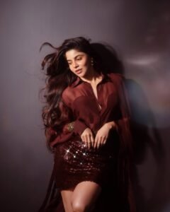 Divya Bharathi in red satin corset dress with gloves during glam shoot