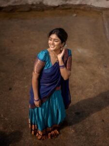 Close-up of Eesha wearing silver chandbalis and jasmine bun