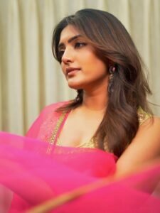 Full-length shot of Eesha posing among flowers in festive Anarkali