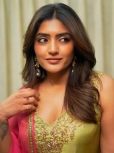 Full-length shot of Eesha posing among flowers in festive Anarkali