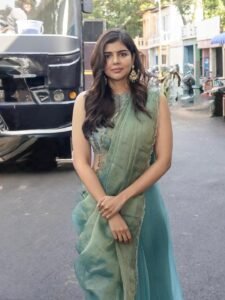 Kalyani Priyadarshan in emerald Kanchipuram saree with gold peacocks