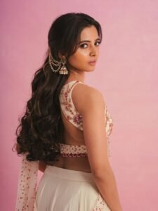 Preethi Asrani in ivory linen wrap dress on beach at sunrise