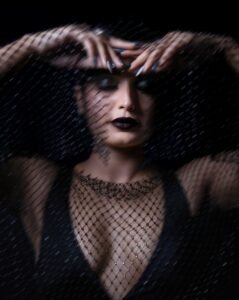 Priyanka Jain in black satin corset dress with gloves during 2025 shoot