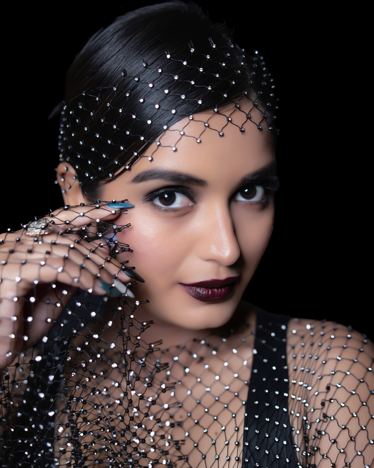 Priyanka Jain in black satin corset dress with gloves during 2025 shoot