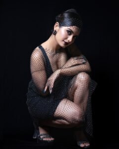 Priyanka Jain in black satin corset dress with gloves during 2025 shoot