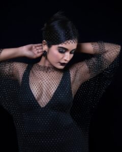 Priyanka with plum lips and diamond studs in black outfit