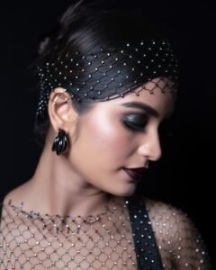 Priyanka with plum lips and diamond studs in black outfit