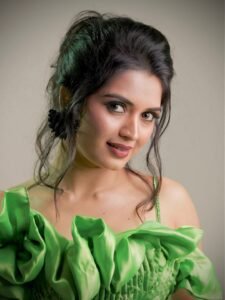 Priyanka Jain in emerald green satin gown during ballroom photoshoot