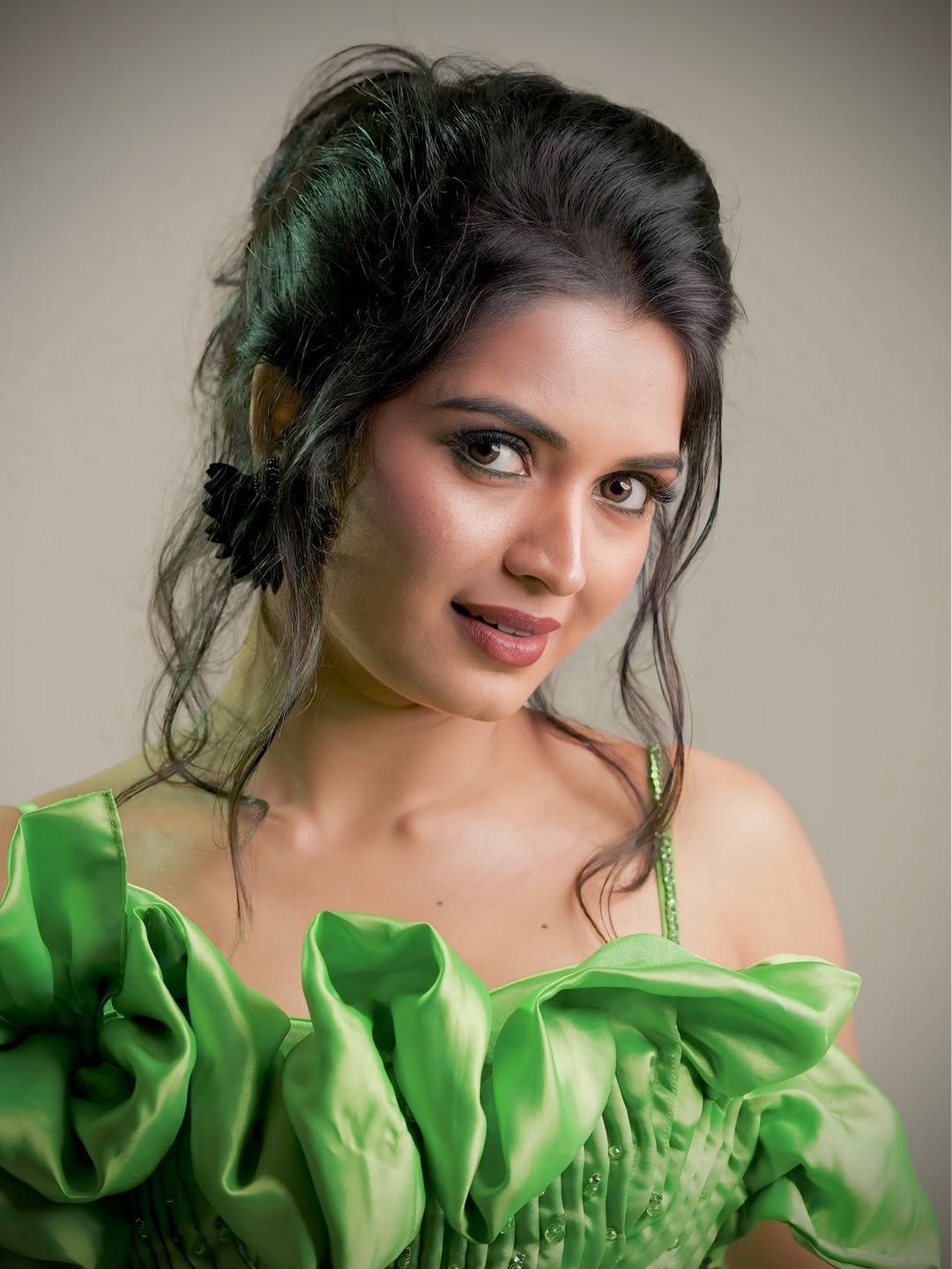 Priyanka Jain in emerald green satin gown during ballroom photoshoot