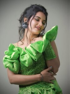 Priyanka with glossy green lips and low chignon hairstyle