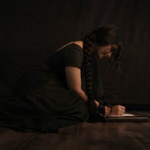 Full-length shot of Priyanka posing with backlight in sheer black saree