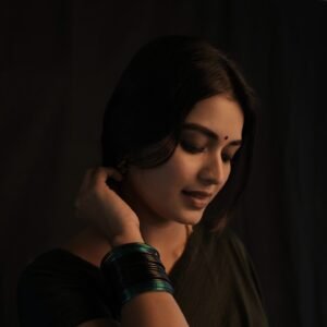 Close-up of Priyanka wearing silver chandbalis and smoky eye makeup