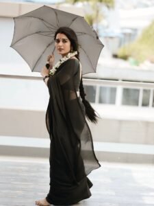 Close-up of Priyanka wearing silver chandbalis and smoky eye makeup