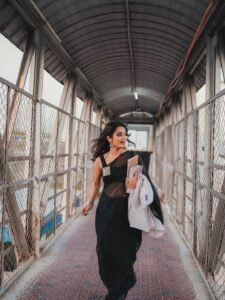 Priyanka Jain in black Kota Doria saree with silver zari during studio shoot