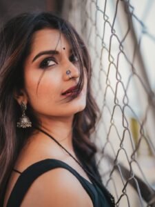 Priyanka Jain in black Kota Doria saree with silver zari during studio shoot