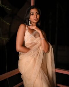 Shivathmika Rajashekar in sheer nude georgette saree with floral embroidery