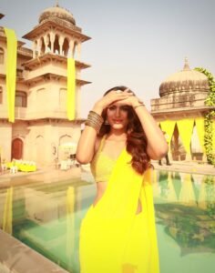 Close-up of Trisha wearing gold vanki and jasmine-adorned bun