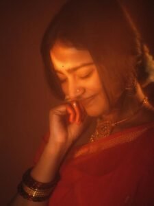 Yoga Lakshmi Golden Hour Close-Up – Traditional Nose Ring & Red Saree Glow (16)