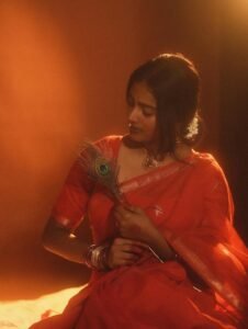 Yoga Lakshmi Golden Hour Close-Up – Traditional Nose Ring & Red Saree Glow (8)