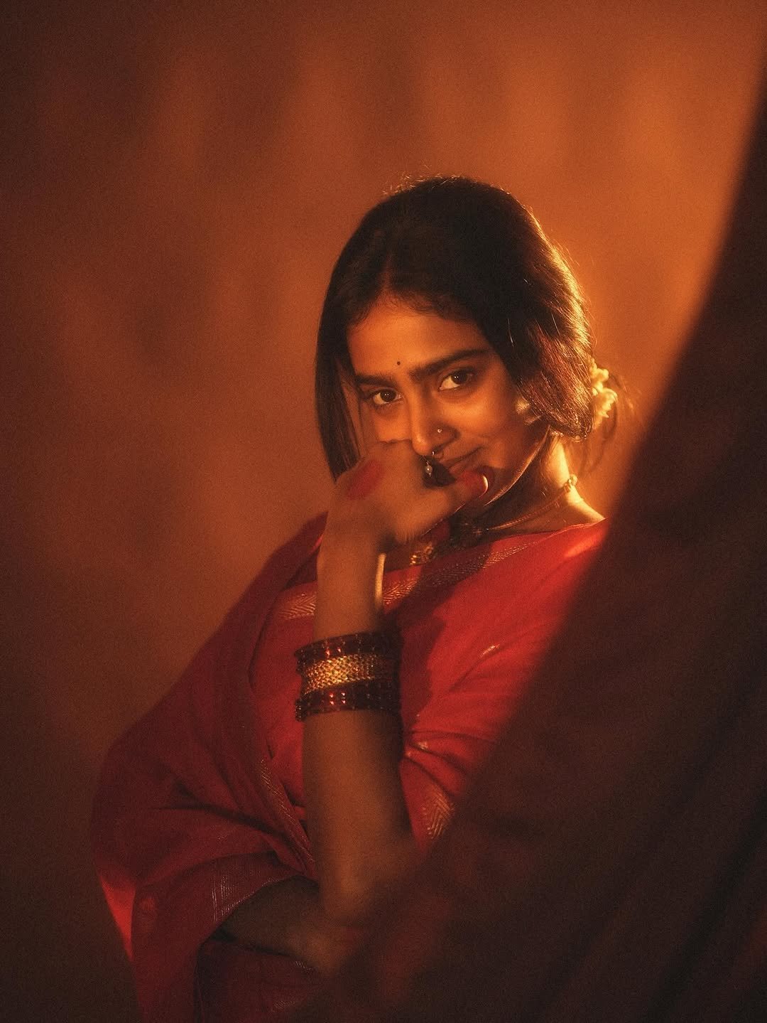 Yoga Lakshmi Golden Hour Close-Up – Traditional Nose Ring & Red Saree Glow (9)