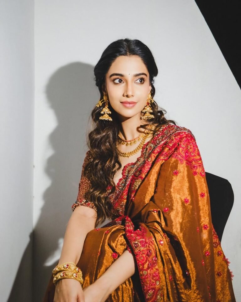 Meenakshi Chaudhary Stunning Red Saree Photos 2026 trending celebrity photos